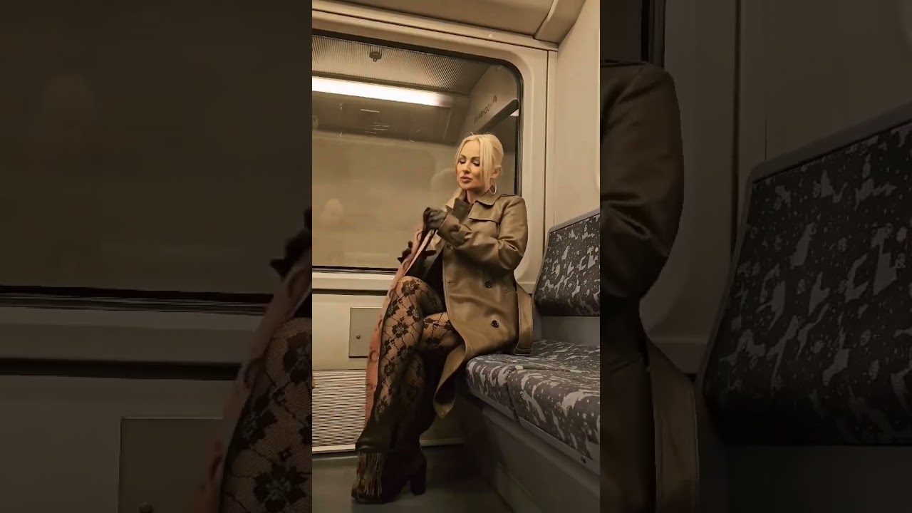 A beautiful woman in pantyhose stockings in public train