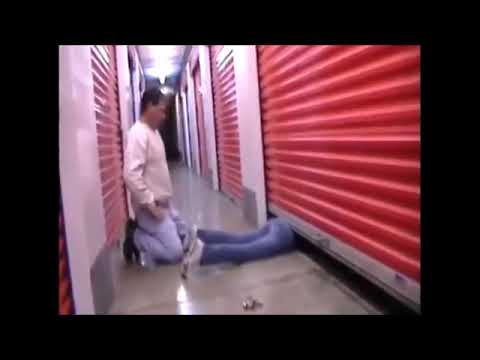 a woman's feet  tickling stuck under a garage door