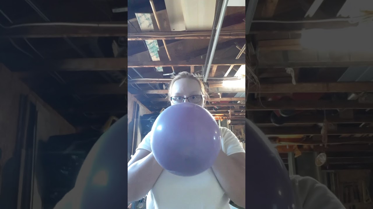 Another video of a purple and pink balloon blow  to pop