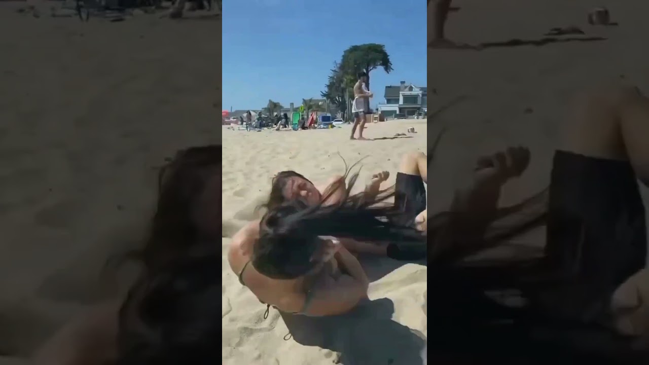 Beach Wrestle - Man vs Woman