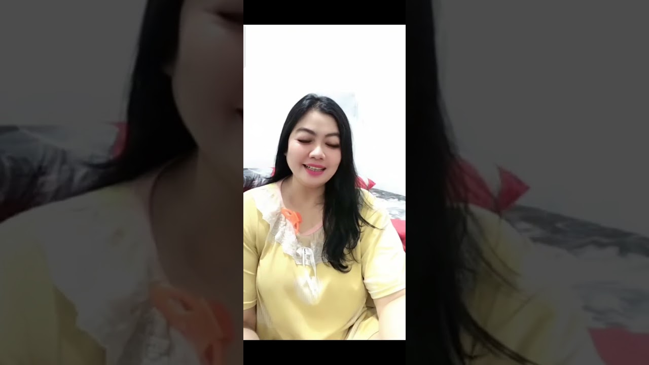 BEAUTIFUL MOTHER IS SITTING RELAXED WHILE CHATTING WEARING HER OFFICE CLOTHES