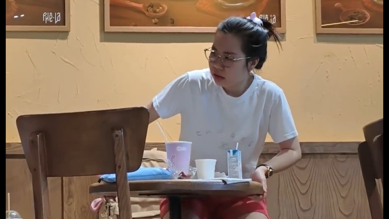 Candid feet asian girl working remotely at a cafe 4K