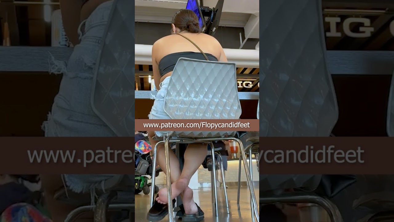 Candid shoeplay in foodcourt
