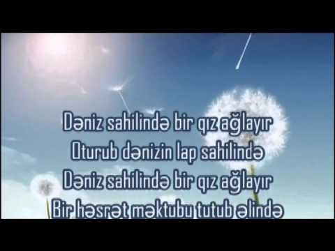 Deniz kenarinda aglayan Qiz