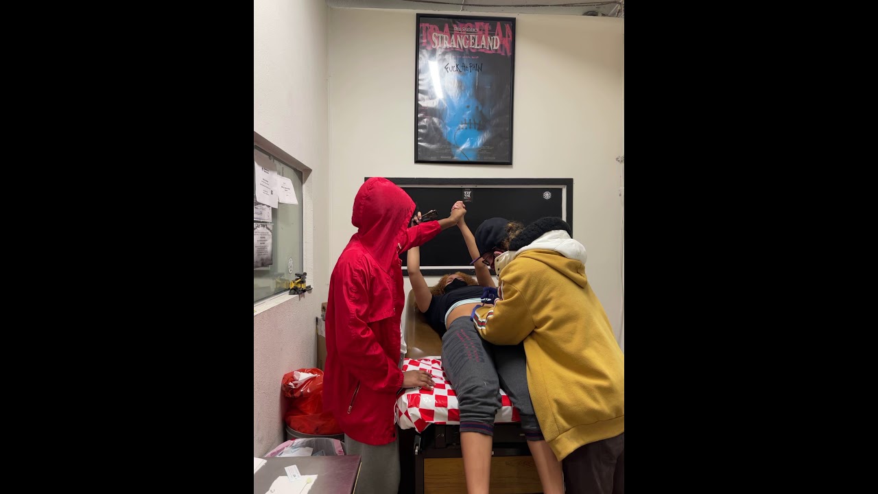 Getting her belly button pierced