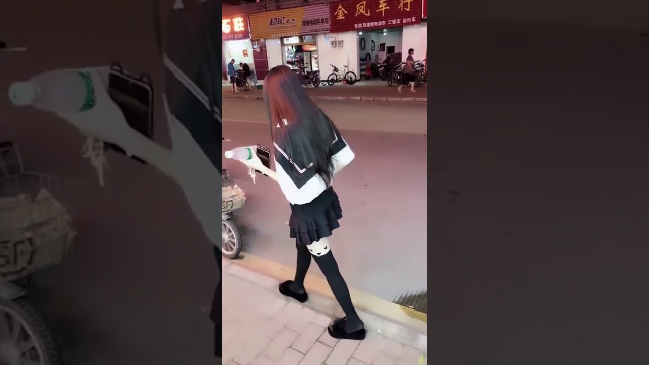Girl in black pantyhose and slippers walking alone