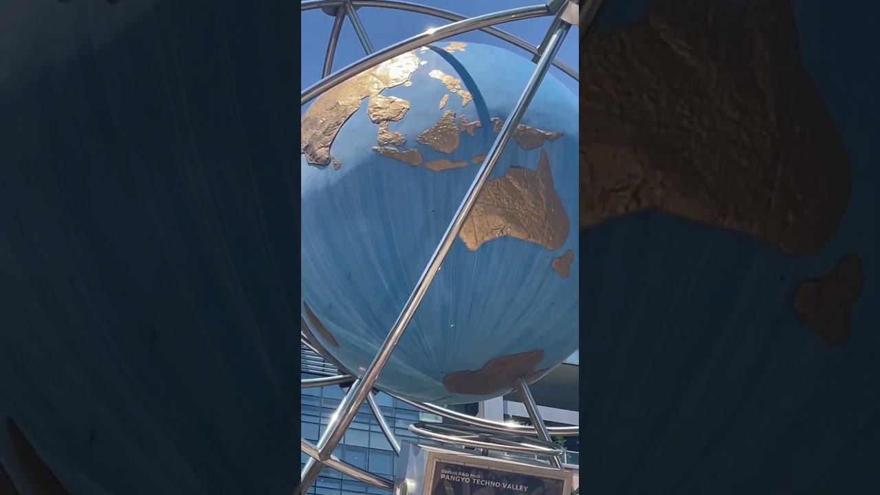 Human Structure holding Blue globe
