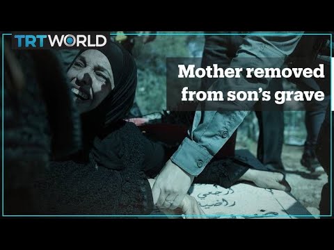Israeli forces pull Palestinian mother away from her son’s grave