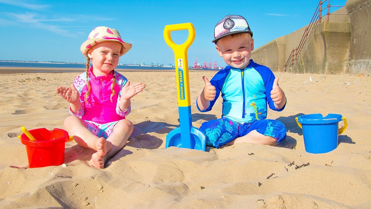 Kids on the Beach Playing Sand and other Kids Toys