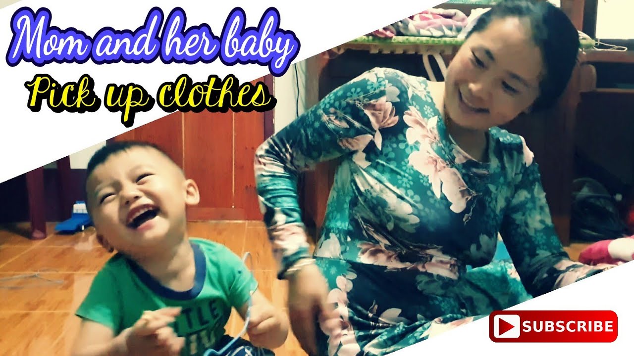 Mom and her baby pick up their clothes