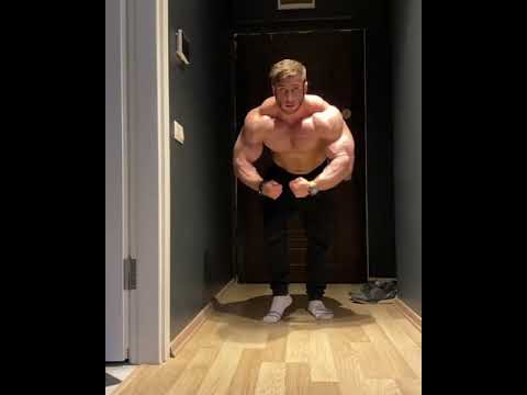 Muscle god Harun Yilmaz flexing in black sweats