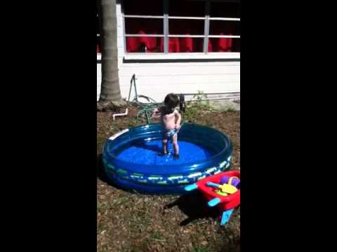 Porter loves the hose and his kiddie pool
