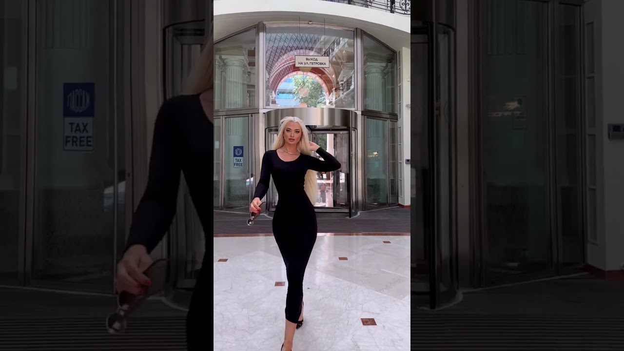 super leggy blonde beautiful in a black dress