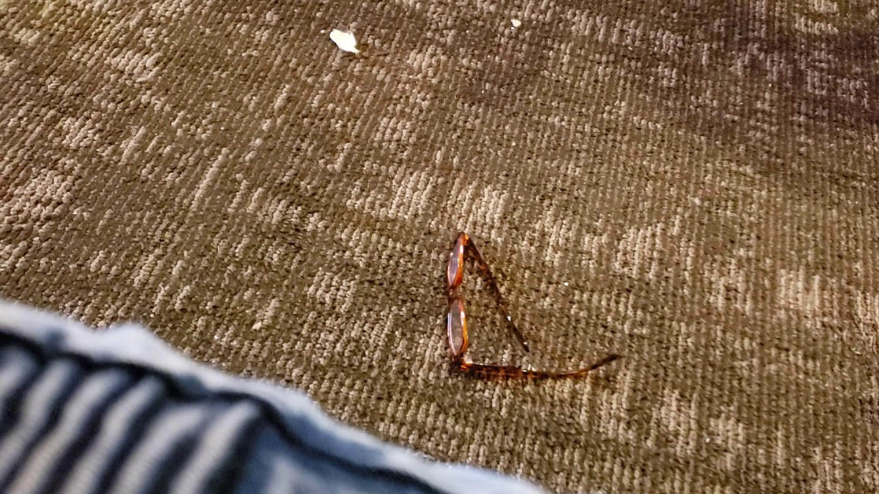 Tall sexy woman steps on my  Glasses.