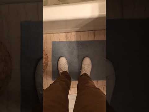 Teen boy white sneakers shoeplay, no socks, bare feet and curling toes