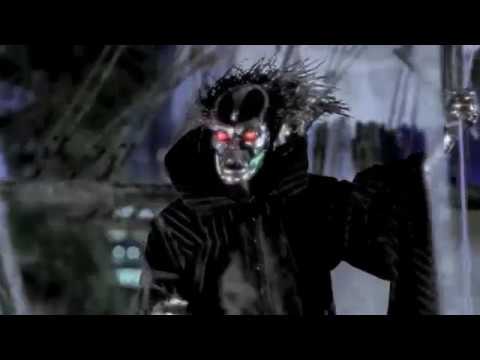 the masked figure arrives